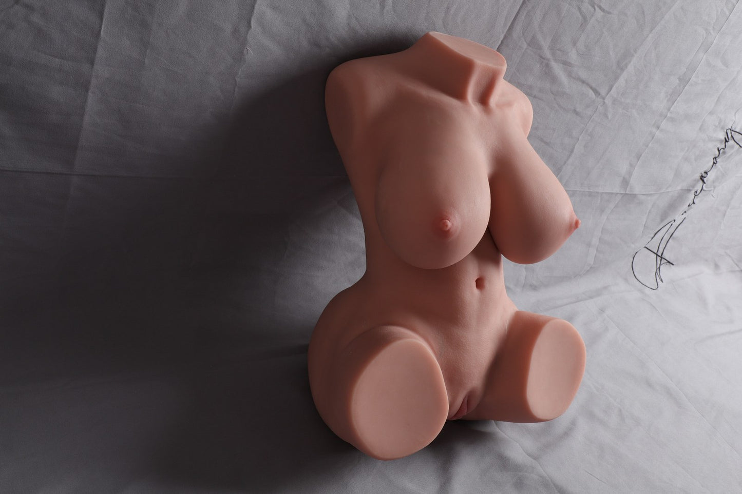 13.5kg busty torso sex doll heavy large breasts model angled front view on grey backdrop
