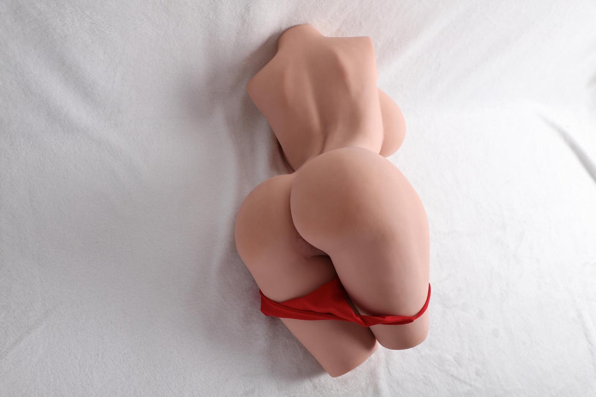angled rear view of 9.5kg curvy torso sex doll highlighting defined curves