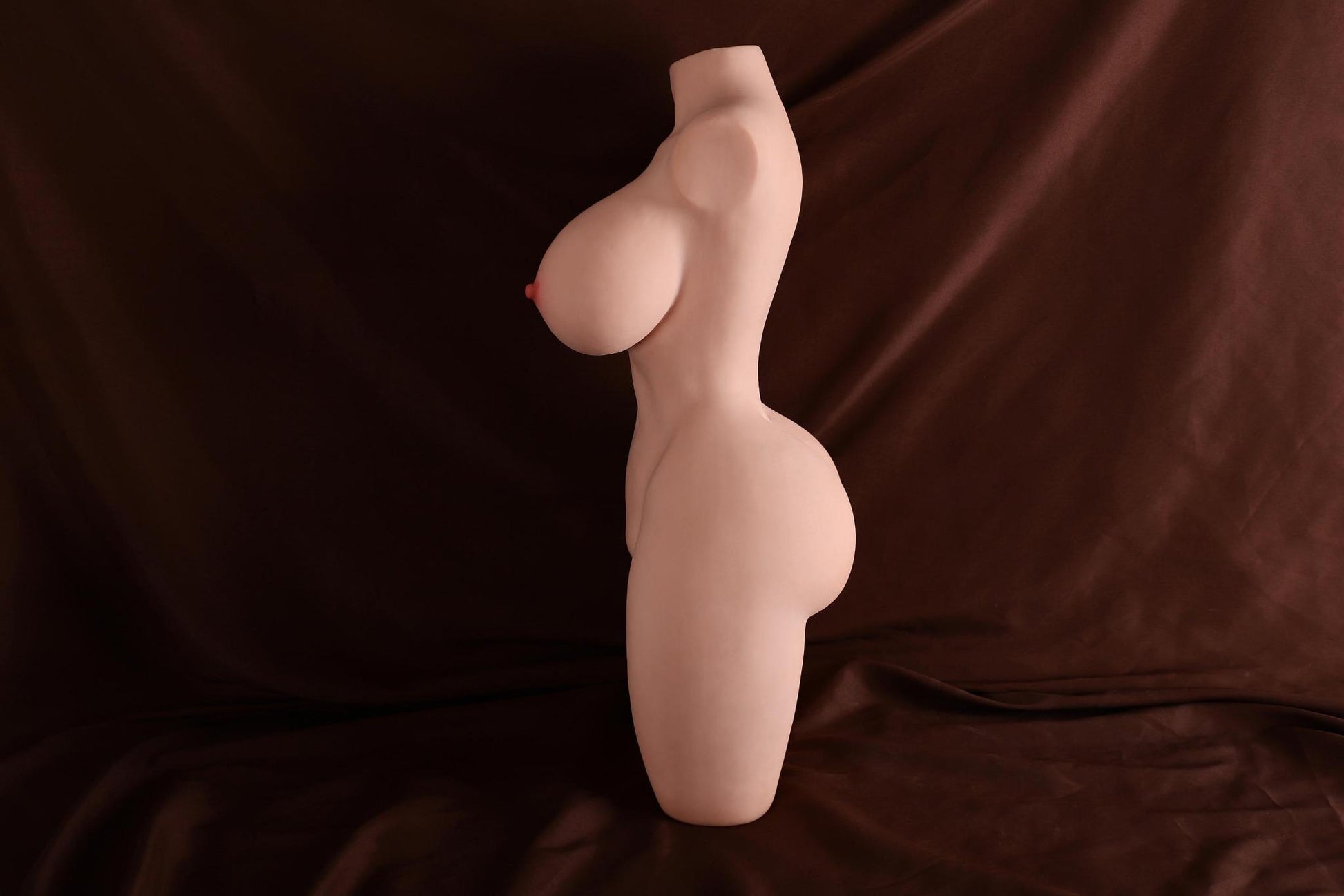 close detail of torso sex doll showing soft-touch material and realistic finish
